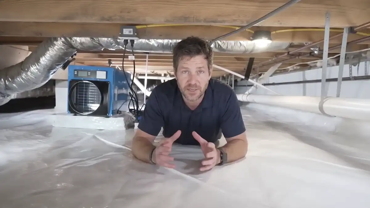 Wide view of a sealed crawl space with white liner and sealed piers in a Tennessee home