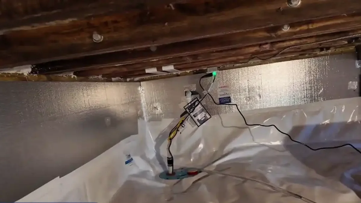 Sump pump and dehumidifier on a sealed vapor barrier, an example of crawl space encapsulation in Virginia Beach, VA